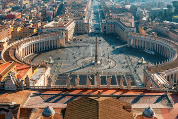 Aerial view of St. Peter's Square in Vatican City with central obelisk, colonnade and Italian architecture on background. Travel landmark in Rome city, Italy. View on Piazza San Pietro from Basilica