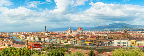 Panoramic aerial view of Florence city with Arno River, Duomo, Ponte Vecchio and historic buildings, Tuscany, Italy. Dome of Cathedral of Santa Maria del Fiore in Firenze town. Italian architecture