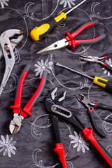  locksmith tools on an embroidered tablecloth