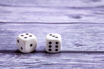 two dice on a wooden surface