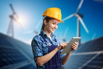 Portrait of a young female engineer at solar panel farm.