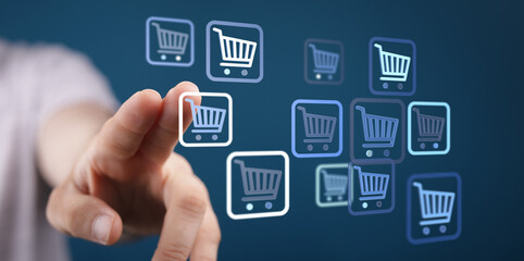 Fototapeta premium Hand touching shopping cart icons, representing online shopping, digital purchase, and e-commerce transactions. Buying and selling concept.