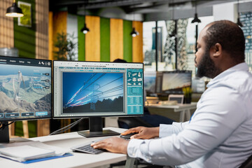 RD office specialist analyzes power lines and futuristic turbine designs to strengthen sustainable...