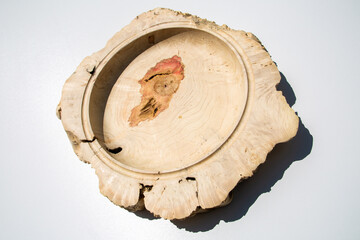 Empty wooden plate on white background