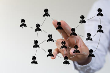 Hand reaching out to interact with network connections and relationships, representing...