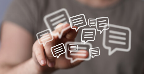 Abstract image representing digital communication and online messaging, featuring hand interaction with chat bubble icons, conveying connection