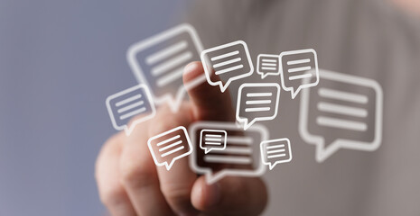 Concept of communication through technology and social media. Finger touching a digital display...