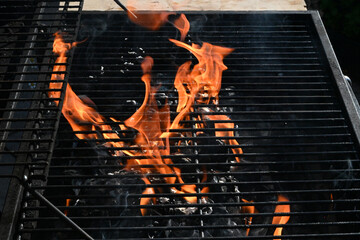 cooking food on charcoal fire summer party fun  