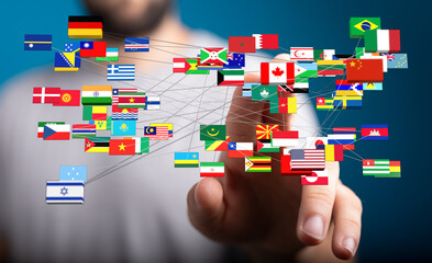 Concept of global connectivity and communication represented by a hand touching a network of flags...