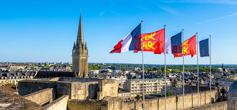 Panoramic view of the historic city of Caen, Normandy, France. French flags and flags of the city of Caen.