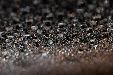 macro close-up of water droplets on a dark background. Mockup for your logo. horizontal wallpaper or web banner.