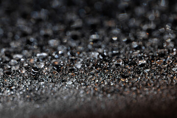 macro close-up of water droplets on a dark background. Mockup for your logo. horizontal wallpaper or web banner.