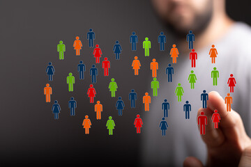 Human figures in diverse colors connected digitally, symbolizing community, networking, and social interaction.