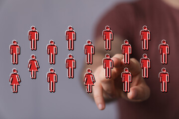 Abstract conceptual image depicting people in a digital world with a pointing hand. Social connection and community visualized.