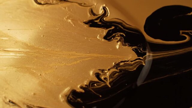 Mesmerizing Abstract Dance of Golden and Dark Liquid Swirls.