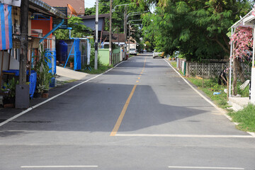 Quiet street with a house on the right side