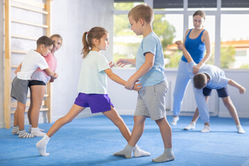 Fototapeta premium Children are focusing on their hand grip techniques to develop better control and power