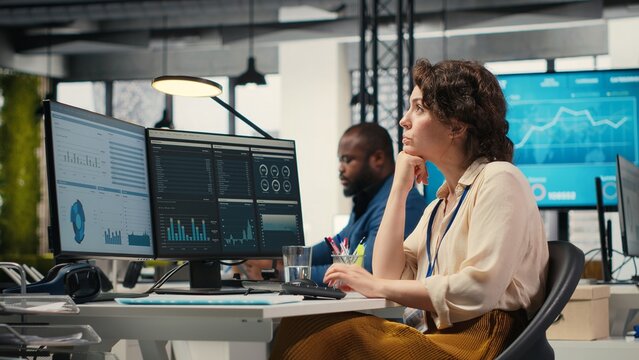 Business consultant focusing on global expansion strategy and planning resource allocation for organization, using digital tools to forecast insights and achieve corporate growth. Camera B.