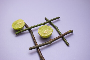 Lime and Bamboo Cross on Lavender Surface