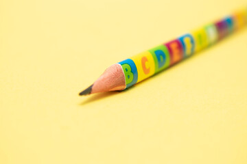 Yellow Pencil with Eraser on Neutral Background