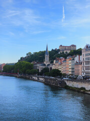 Naklejka premium Lyon, France, May 29, 2025, View of the Rhone River and its embankment, waterfront Blue Sky