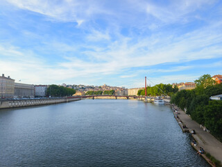 Obraz premium Lyon, France, May 29, 2025, View of the Rhone River and its embankment, waterfront Blue Sky