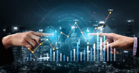 Two hands reaching towards a financial graph showing growth trends against a nighttime urban background. Emphasizes connection in data-driven business decisions. Scalp