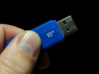 16GB Blue USB Flash Drive in Hand