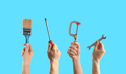 People holding different tools in hands against light blue background, closeup. Collage