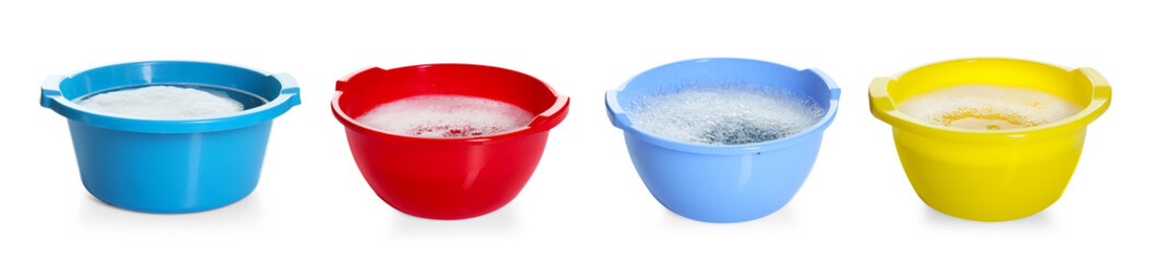 Colorful plastic basins with water isolated on white, set