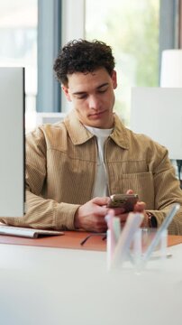 Phone, break and business man in office, reading email and bored copywriter check review online. Lazy content writer, mobile and scroll article, newsletter or disinterested with creative information
