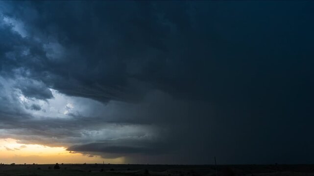 Lightning storm illuminating horizon beneath dark turbulent skies 