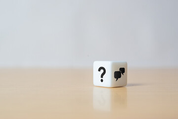 Q and A concept. Q and A symbols on white dice on a grey background. Illustration for frequently...