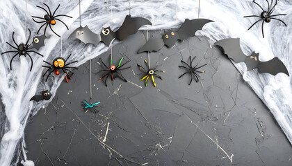 Halloween Decoration Featuring Colorful Spiders and Bats on a Dark Background with Cobwebs