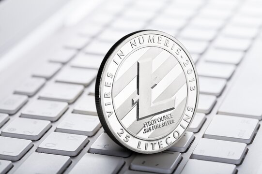 Bitcoin coin on computer keyboard. Crypto money