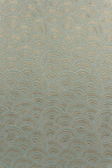 Light olive-beige brocade fabric texture with wave pattern and yellow metallic lurex, textile collection