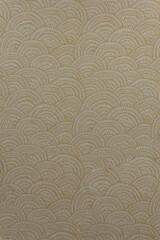 Light beige brocade fabric texture with wave pattern and metallic threads, textile collection