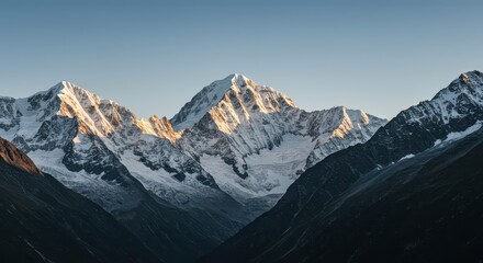 Fototapeta premium Towering rugged mountain ranges featuring immense snow caps and icy ridges pierce the atmosphere under a brilliant sun, showing pristine wilderness ,nature ,climate ,travel