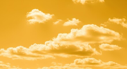 A stunning, saturated yellow sky filled with fluffy white cumulus clouds floating gently across the vast, warm expanse. Peaceful summer backdrop ,summer ,intense ,cheerful