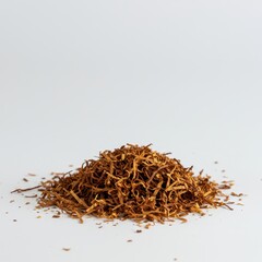 Loose, shredded tobacco isolated on a pure white surface, emphasizing the raw material used for crafting handrolled cigarettes and smoking products ,loose ,cigarette ,brown