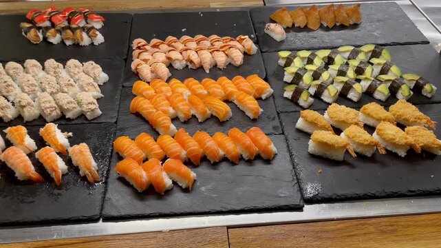 Fresh sushi displayed on buffet counter variety of healthy food colorful ingredients Japanese cuisine restaurant presentation delicious and visually appealing meal