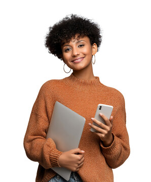 happy and smiling Hispanic teenage girl holding a laptop and smartphone, isolated on white or transparent background