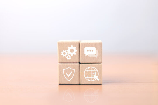 Wooden blocks with gear, chat, security shield and globe icons representing technology, communication, cyber security and global networking concept, digital marketing and online business illustration.