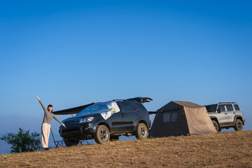 Asian woman traveler relaxes in the morning with beautiful natural scenery of the sea of mist at...