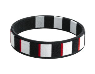 Striped Wristband A patterned fabric wristband with alternating black and white rectangles & thin red lines on a black band