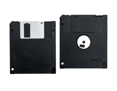 Two black 5.25" floppy disks sit against a black background, one label facing forward, the other backwards