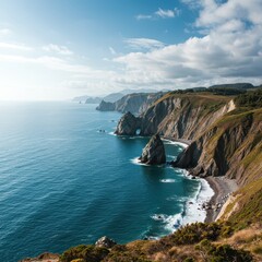 Fototapeta premium Dramatic coastal vista featuring rugged towering cliffs overlooking the deep blue ocean water under a vast summer sky ,formation ,seascape ,remote