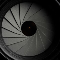 Extreme close up of the diaphragm blades forming the aperture opening in a camera lens mechanism, illustrating the technical function ,technical ,setting ,mechanism