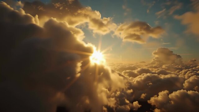 A glorious golden sunrise with brilliant sunbeams shining through a magnificent layer of clouds from an aerial perspective