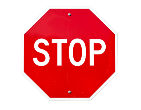 Red octagon sign with white "STOP" against black. Shows texture & slight wear from outdoor exposure